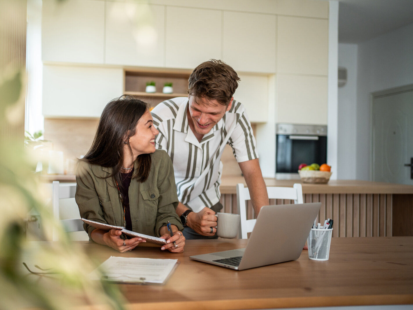 Planning Renovation Project Couple reviewing home renovation plans and project budget